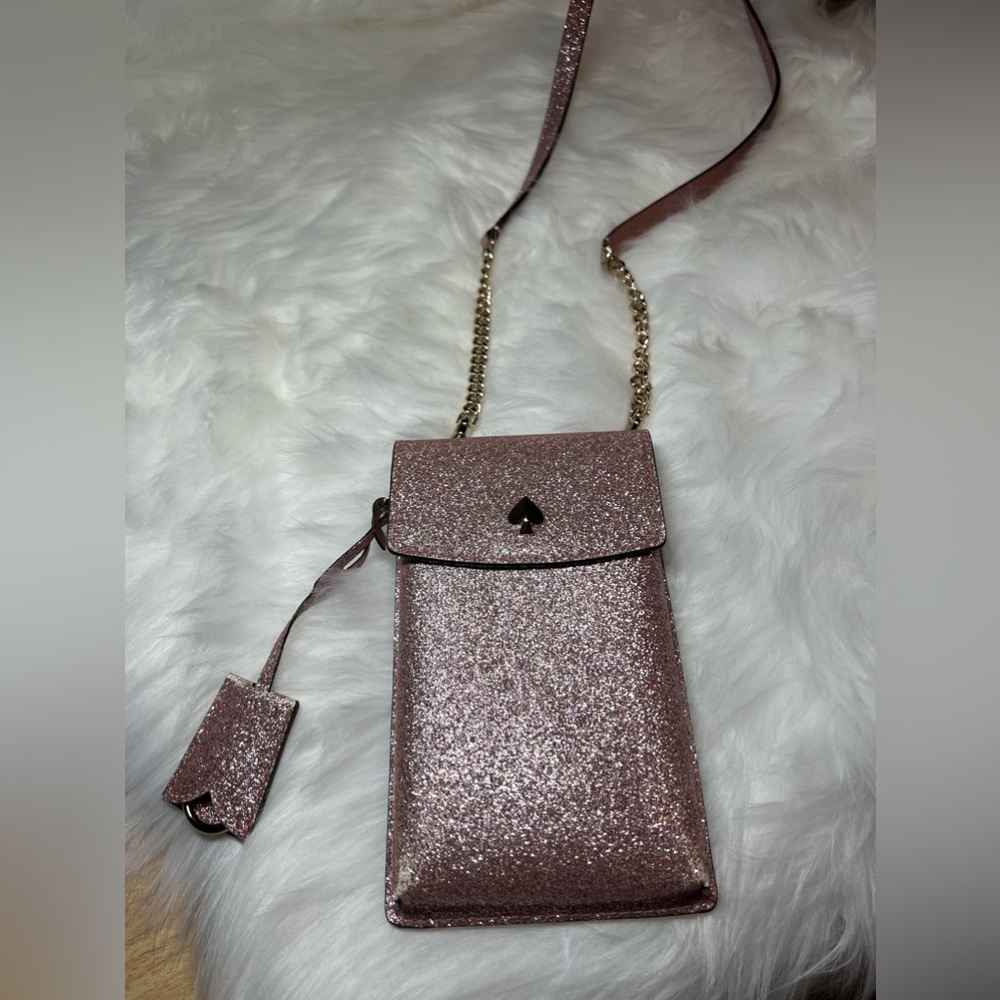 Pink sparkling cross-body bag from Kate Spade.
